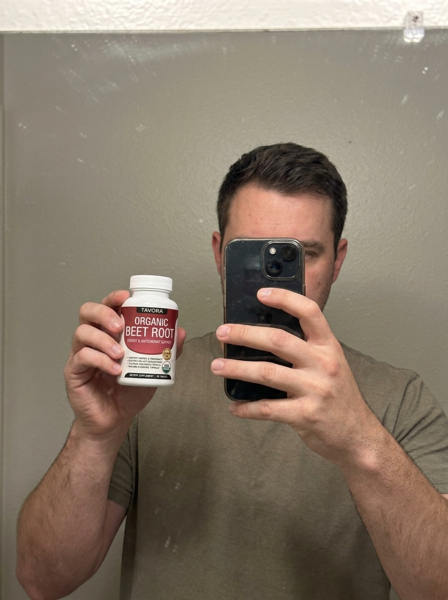 Ryan P. holding a bottle of Tavora Organic Beet Root